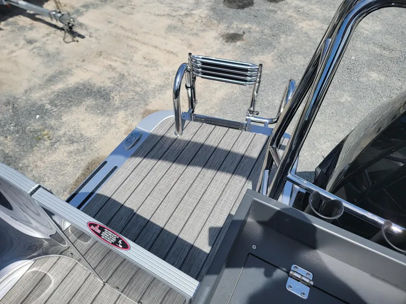 Slide: The Image of 2025 Harris Cruiser 210 boat deck with stainless steel ladder. - 27