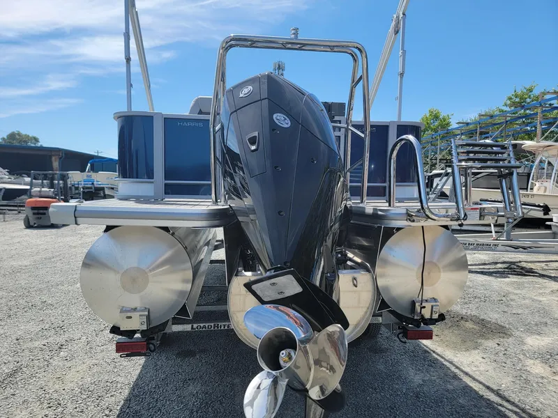 Slide: The Image of 2025 Harris Cruiser 210 pontoon boat rear view with outboard motor. - 3