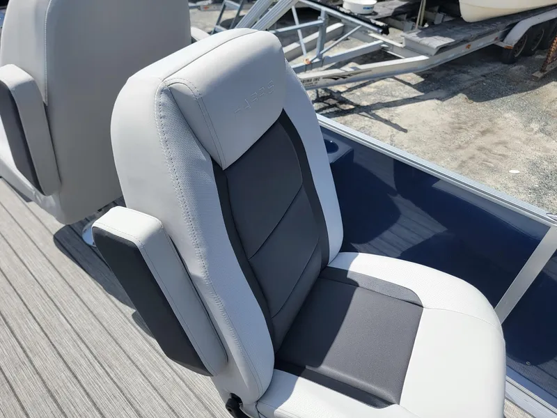 Slide: The Image of 2025 Harris Cruiser 210 boat seat with gray and white upholstery. - 30