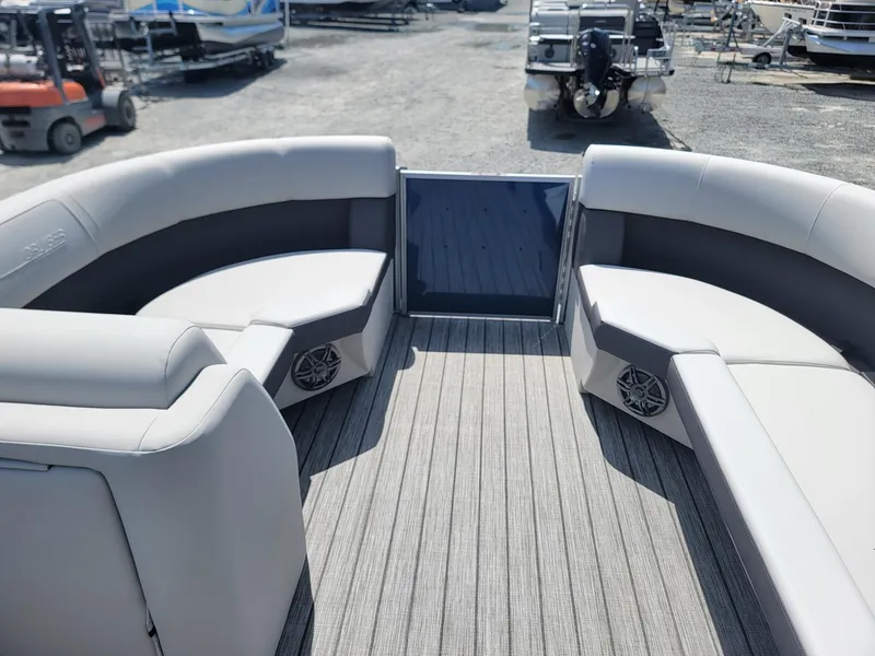 Slide: The Image of 2025 Harris Cruiser 210 boat interior with gray seating and flooring. - 34