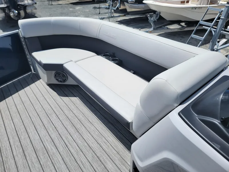 Slide: The Image of 2025 Harris Cruiser 210 boat interior with gray seating and deck. - 36