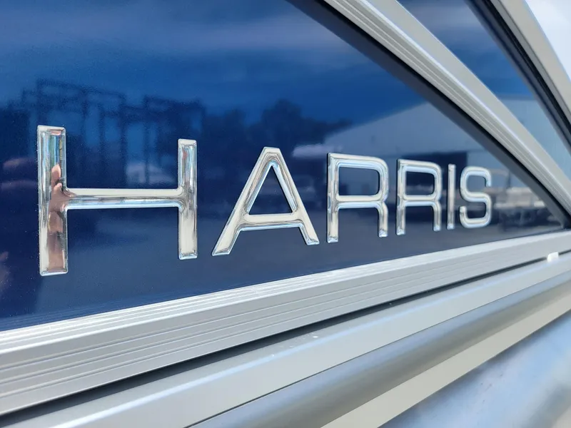 Slide: The Image of Harris Cruiser 210 2025 model nameplate on blue background. - 39