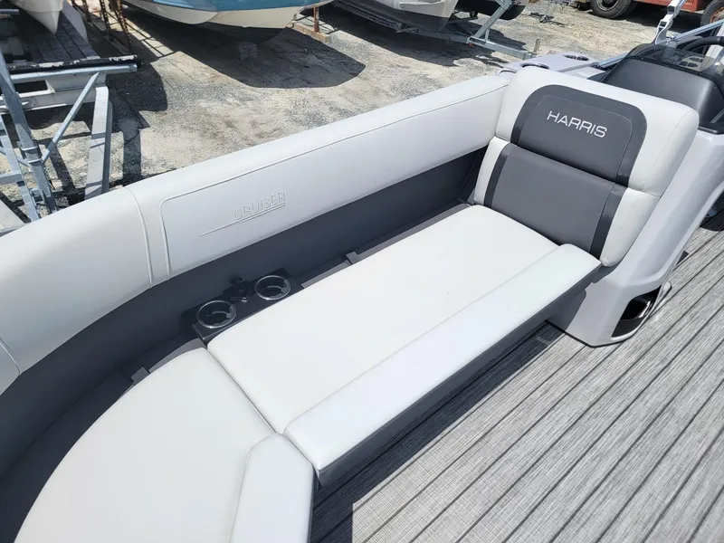 Slide: The Image of 2025 Harris Cruiser 210 boat interior with gray and white seating. - 9