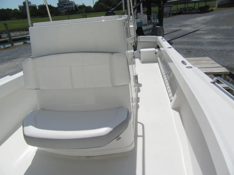 Slide: The Image of 2025 Parker 2300 SE CC boat interior with white seating and console. - 10