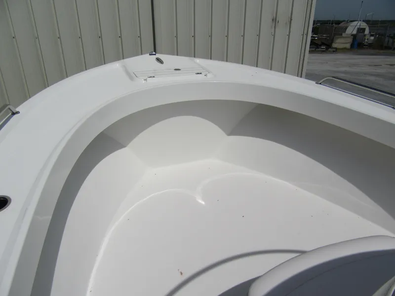 Slide: The Image of 2025 Parker 2300 SE CC boat's clean, spacious bow area with white interior. - 7