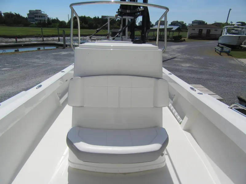 Slide: The Image of 2025 Parker 2300 SE CC boat interior with white seating and console. - 8