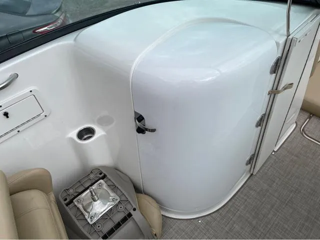 Slide: The Image of Interior of a 2020 NauticStar 243 DC boat showing seating and storage. - 12