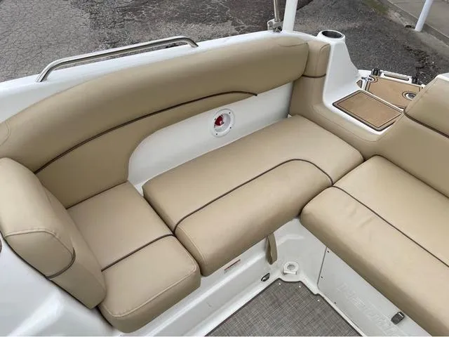 Slide: The Image of 2020 NauticStar 243 DC boat with beige cushioned seating. - 16