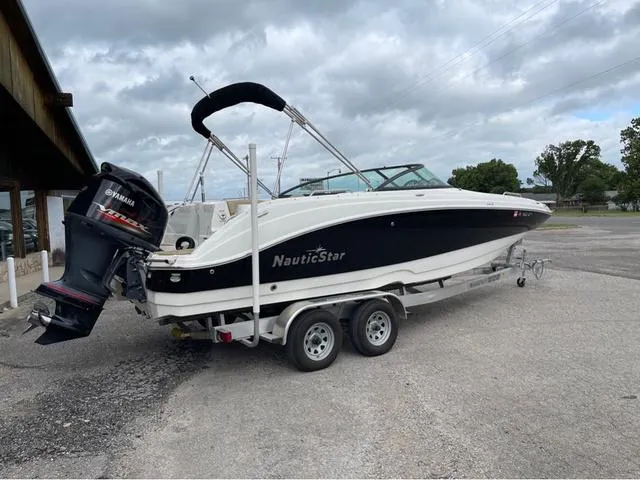 Slide: The Image of 2020 NauticStar 243 DC boat on trailer with Yamaha outboard motor. - 3