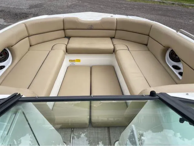 Slide: The Image of 2020 NauticStar 243 DC boat with spacious tan seating area. - 7