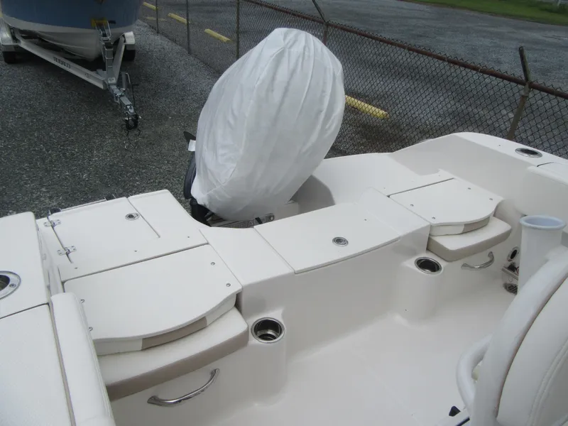 Slide: The Image of 2025 Robalo R200 Center Console boat interior with covered outboard motor. - 16