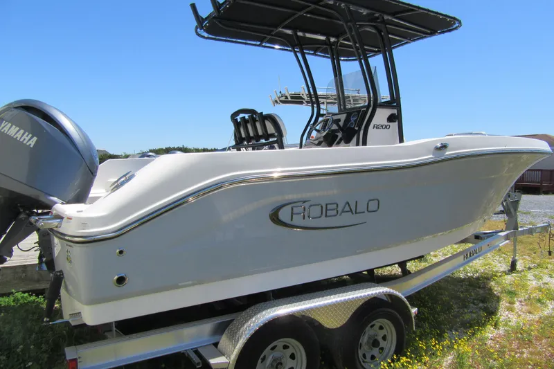 Slide: The Image of 2025 Robalo R200 Center Console boat on trailer with Yamaha engine. - 1