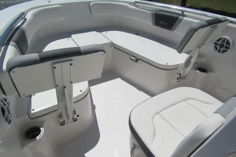 Slide: The Image of 2025 Robalo R200 Center Console boat interior with cushioned seating and storage compartments. - 10