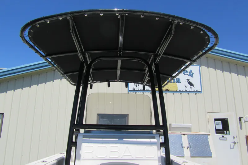 Slide: The Image of 2025 Robalo R200 Center Console boat with T-top, viewed from the rear. - 13