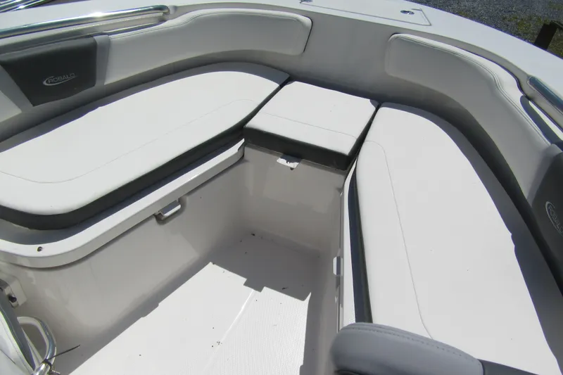 Slide: The Image of 2025 Robalo R200 Center Console boat interior with cushioned seating and storage. - 14
