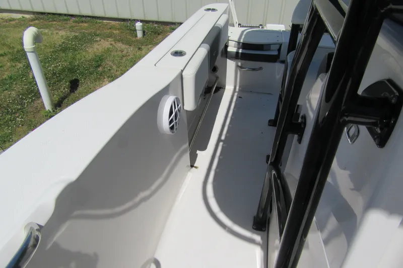 Slide: The Image of 2025 Robalo R200 Center Console boat interior with seating and storage compartments. - 16