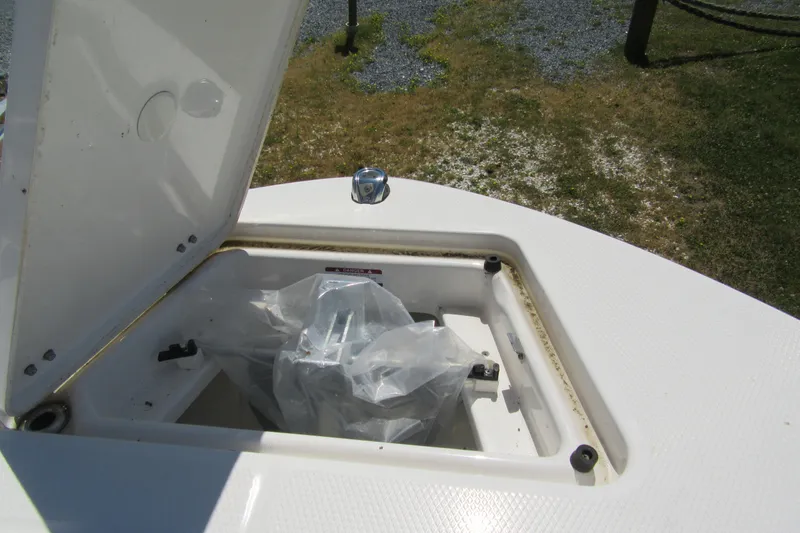 Slide: The Image of Open storage compartment on 2025 Robalo R200 Center Console boat. - 17