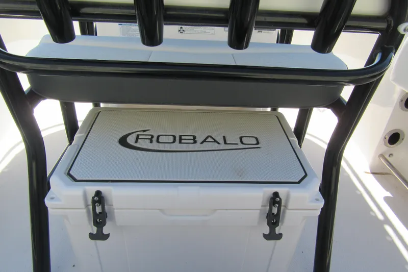 Slide: The Image of 2025 Robalo R200 Center Console boat cooler with logo under seat. - 6