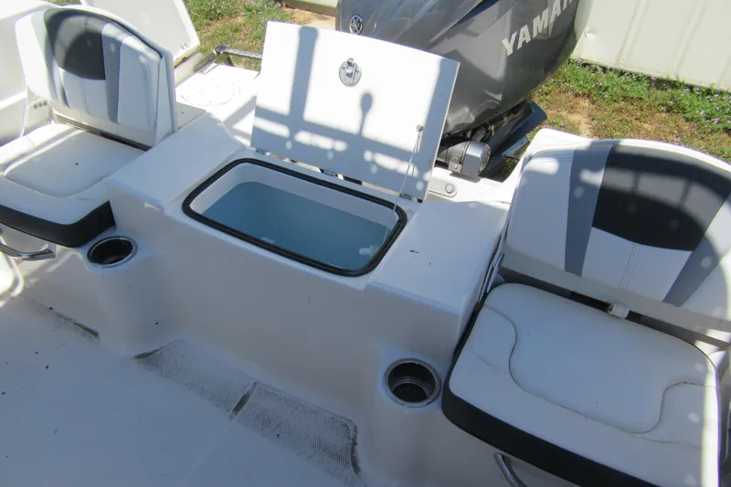 Slide: The Image of 2025 Robalo R200 Center Console boat interior with seating and storage compartments. - 9