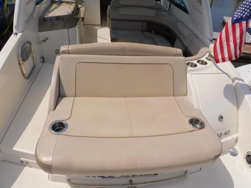 Slide: The Image of 2015 Formula Bowrider 290 interior with beige seating and cup holders. - 16