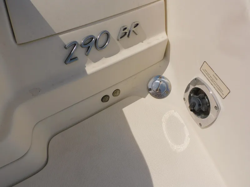 Slide: The Image of 2015 Formula Bowrider 290 boat detail showing model number and waste outlet. - 19