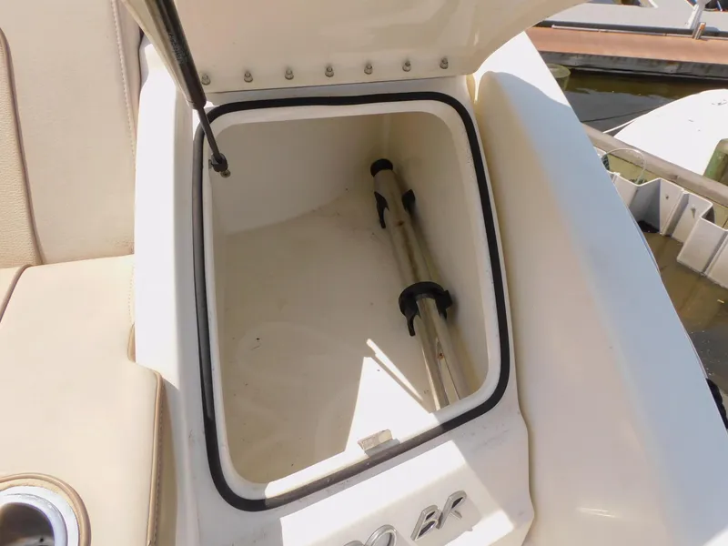 Slide: The Image of Open storage compartment on 2015 Formula Bowrider 290 boat, showing interior space. - 20
