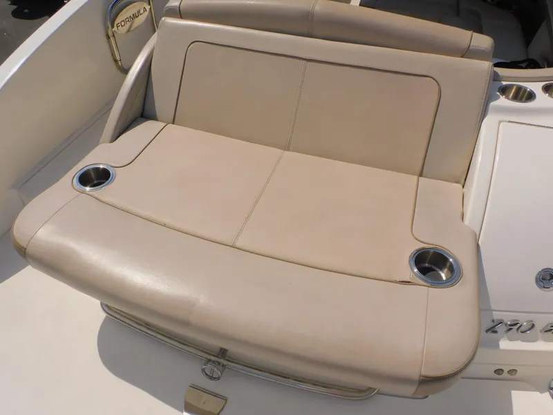 Slide: The Image of 2015 Formula Bowrider 290 boat seat with cup holders, beige upholstery. - 21