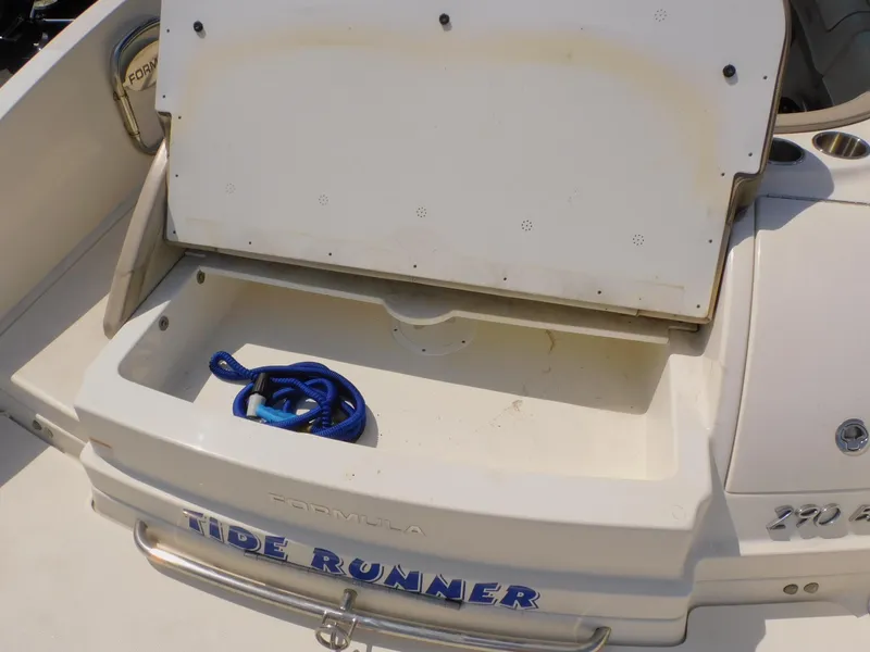 Slide: The Image of 2015 Formula Bowrider 290 storage compartment with blue rope, labeled "Tide Runner." - 22