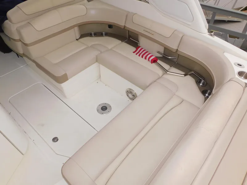 Slide: The Image of 2015 Formula Bowrider 290 interior with beige seating and striped pillow. - 29