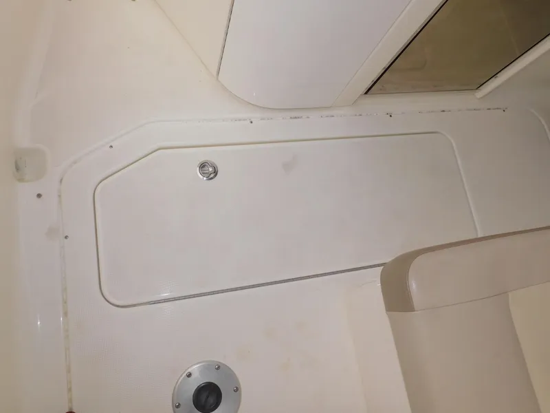 Slide: The Image of 2015 Formula Bowrider 290 interior detail, featuring storage compartment and seating area. - 36