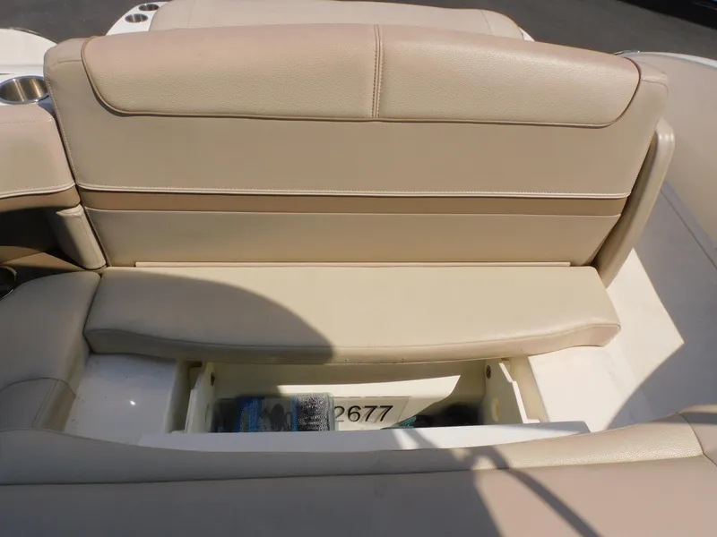 Slide: The Image of 2015 Formula Bowrider 290 boat seat with storage compartment open. - 38