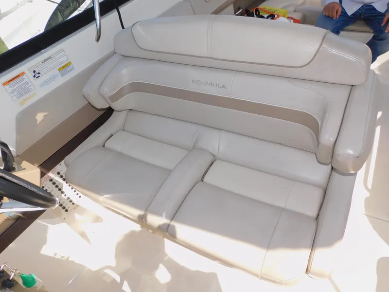 Slide: The Image of 2015 Formula Bowrider 290 interior seating, featuring luxurious beige upholstery. - 48