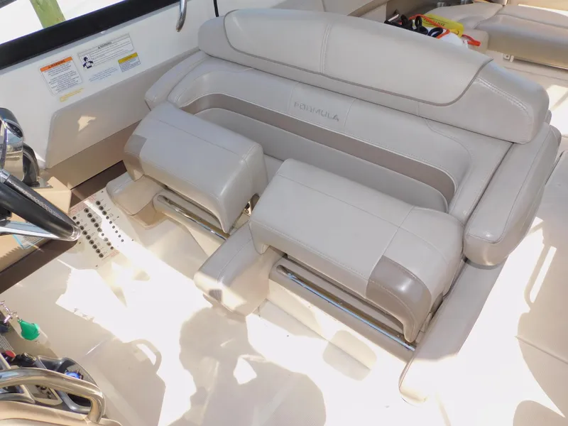 Slide: The Image of 2015 Formula Bowrider 290 interior with luxurious beige seating and steering wheel. - 49
