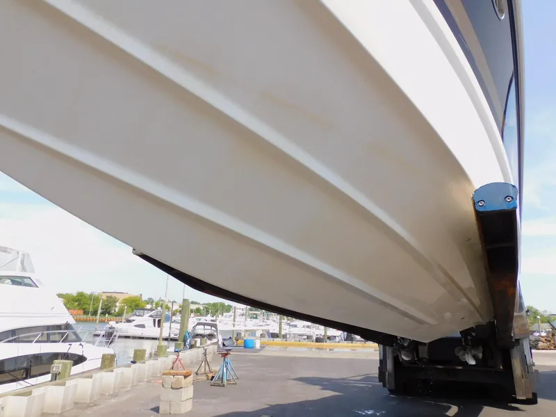 Slide: The Image of 2015 Formula Bowrider 290 boat hull, docked at marina with other boats. - 6