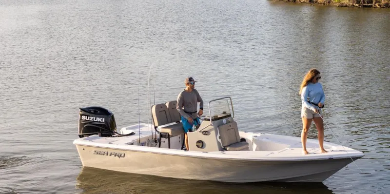 Slide: The Image of 2024 Sea Pro 210 Bay boat on water with two people onboard. - 1