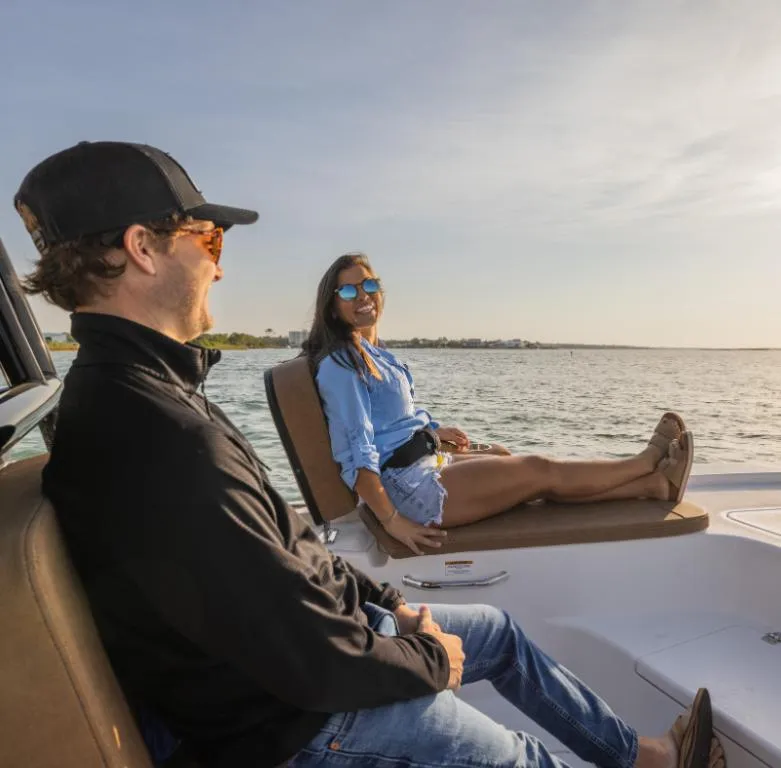 Slide: The Image of Couple enjoying a ride on a 2024 Sea Pro 230 Bay boat. - 6