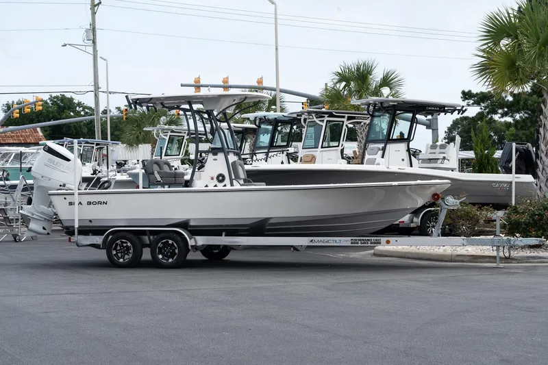 The Image of 2024 Sea Born FX24 Bay boat on a trailer in a marina. - 1