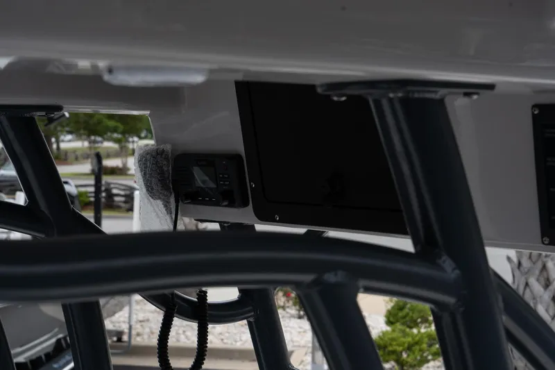 Slide: The Image of 2024 Sea Born FX24 Bay boat console with electronics and storage compartment. - 14
