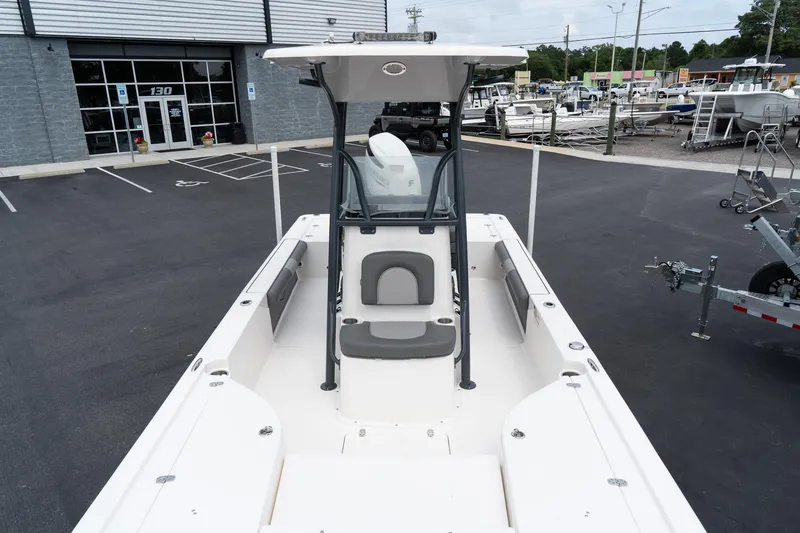 Slide: The Image of 2024 Sea Born FX24 Bay boat at a dealership. - 17