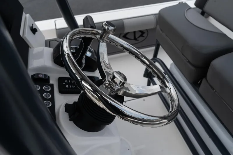 Slide: The Image of 2024 Sea Born FX24 Bay boat steering wheel and control panel. - 23