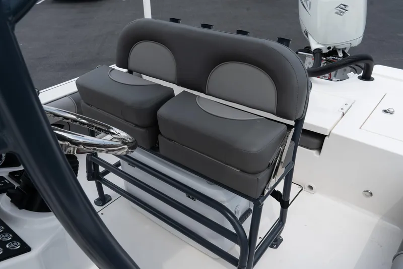 Slide: The Image of 2024 Sea Born FX24 Bay boat seating and console area. - 24