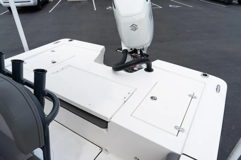 Slide: The Image of 2024 Sea Born FX24 Bay boat with outboard motor and storage compartments. - 27