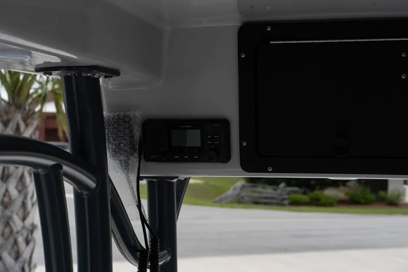 Slide: The Image of 2024 Sea Born FX24 Bay boat console with electronic display and storage compartment. - 29