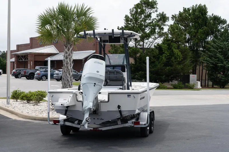 Slide: The Image of 2024 Sea Born FX24 Bay boat on trailer, rear view in parking lot. - 3