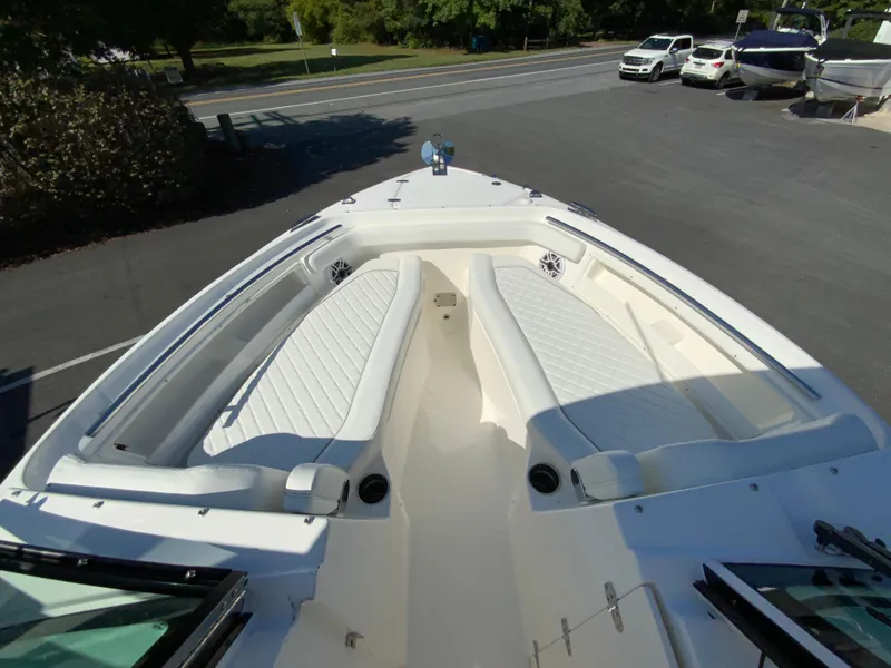 Slide: The Image of 2025 Pursuit DC 246 Dual Console boat with spacious seating and sleek design. - 21