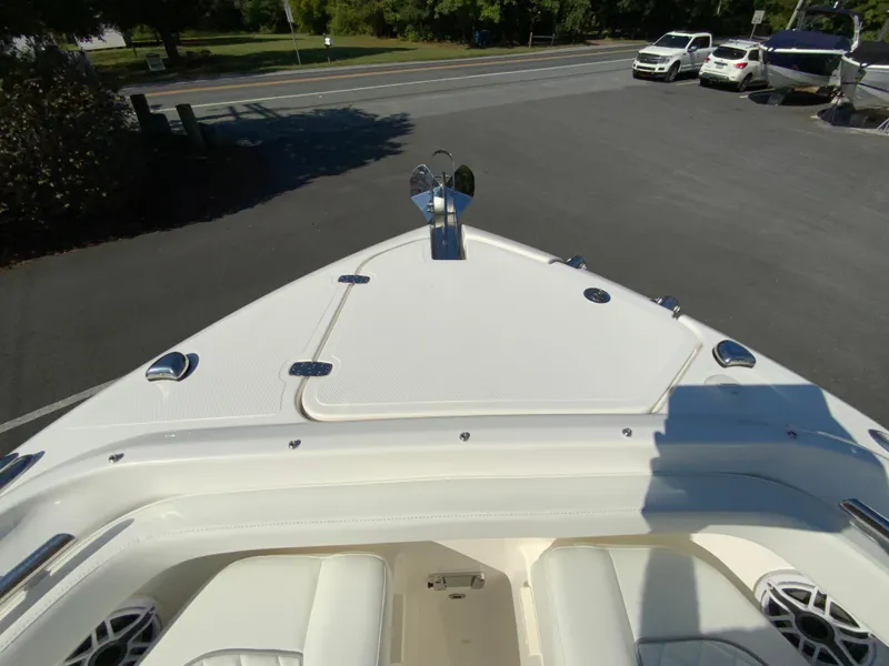Slide: The Image of 2025 Pursuit DC 246 Dual Console boat, bow view in parking lot. - 22