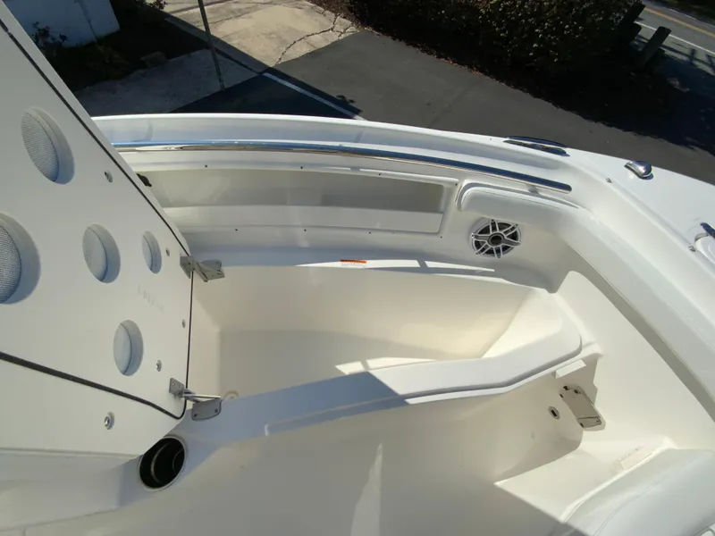 Slide: The Image of 2025 Pursuit DC 246 Dual Console boat interior with seating and speaker. - 24