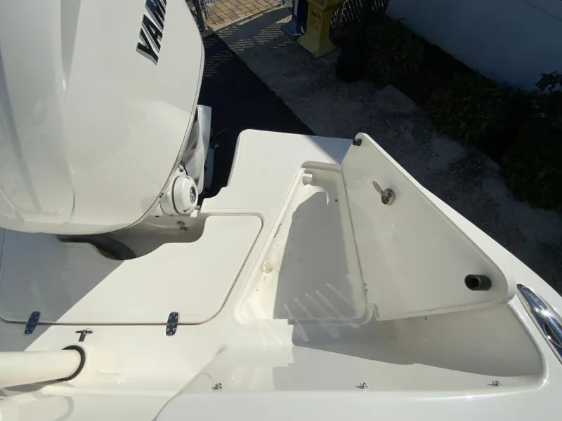 Slide: The Image of 2025 Pursuit DC 246 Dual Console boat with Yamaha engine, rear deck view. - 31
