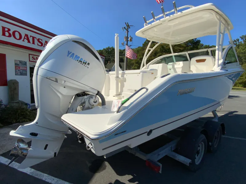 Slide: The Image of 2025 Pursuit DC 246 Dual Console boat with Yamaha engine on trailer. - 9
