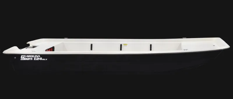 Slide: The Image of 2024 Carolina Skiff E24 DLX TH boat, side view, black hull, white interior. - 0
